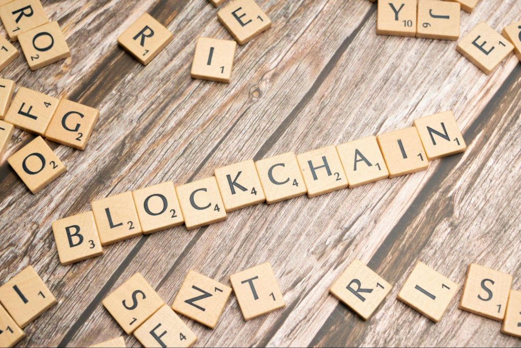 Image showing blockchain written with scrabble blocks.