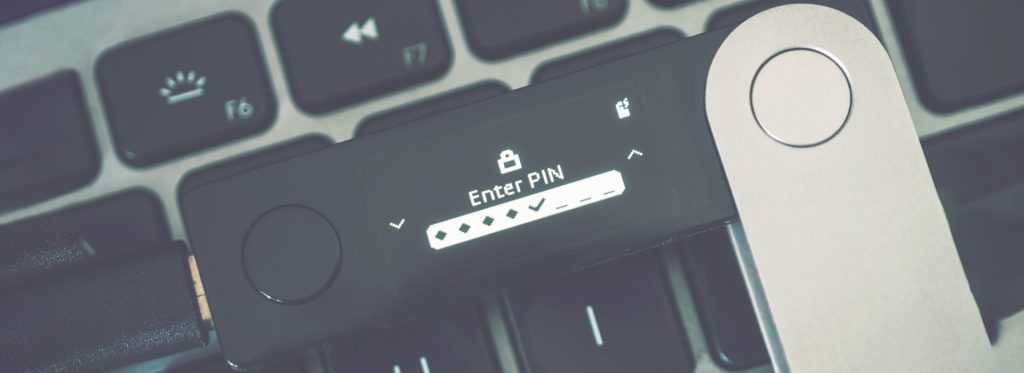 Cover image for Choosing a Hardware Wallet, showcasing a hardware wallet on a keyboard