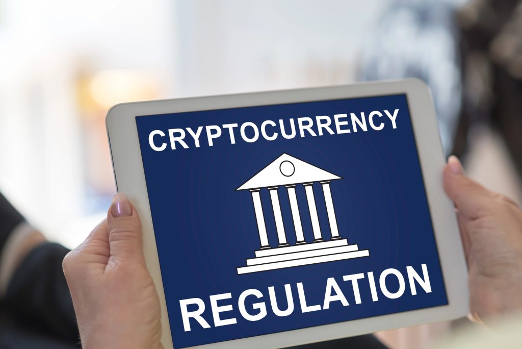 Image showing crypto regulation text written on an iPad.